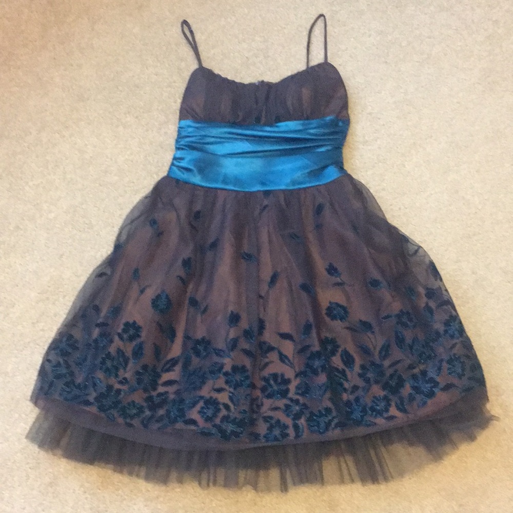 Brown with teal flower accents and cummerbund